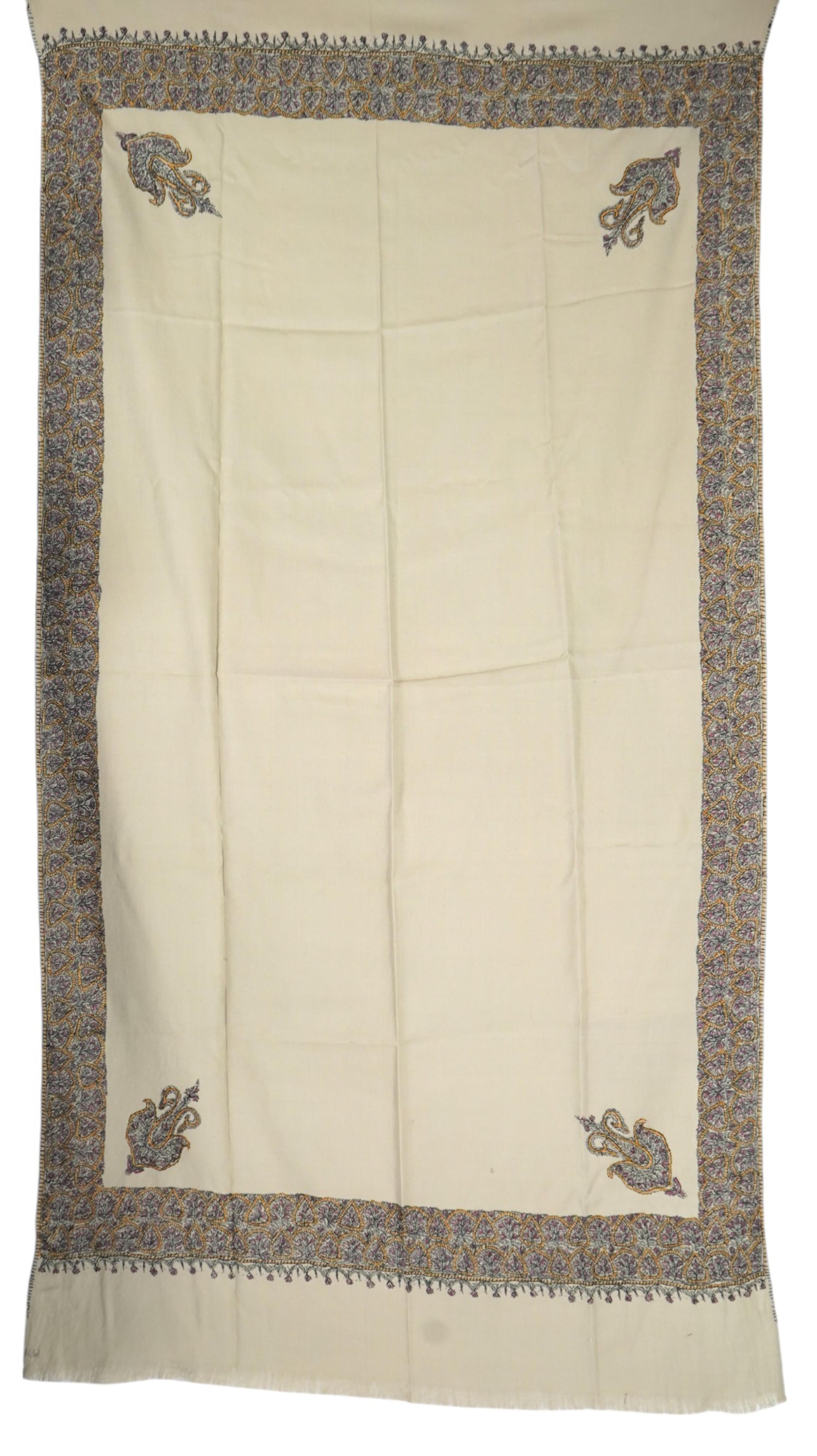 A 20th century ladies mushroom coloured Kashmiri black, yellow and grey silk embroidered stole, with two fine fringe edges, 190 cm long. Condition - a small moth hole near the embroidered border and one mark near one end